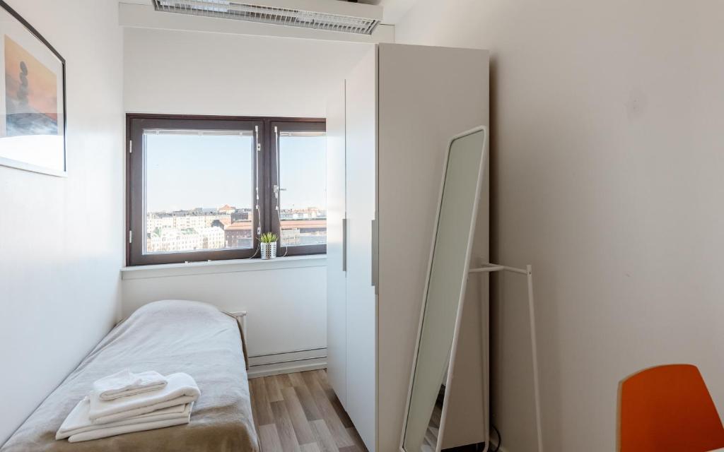 Postel nebo postele na pokoji v ubytování Sky Hostel Helsinki