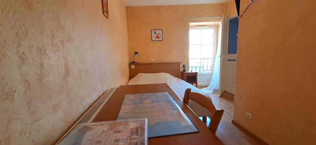 Postel nebo postele na pokoji v ubytování Le Marmagne