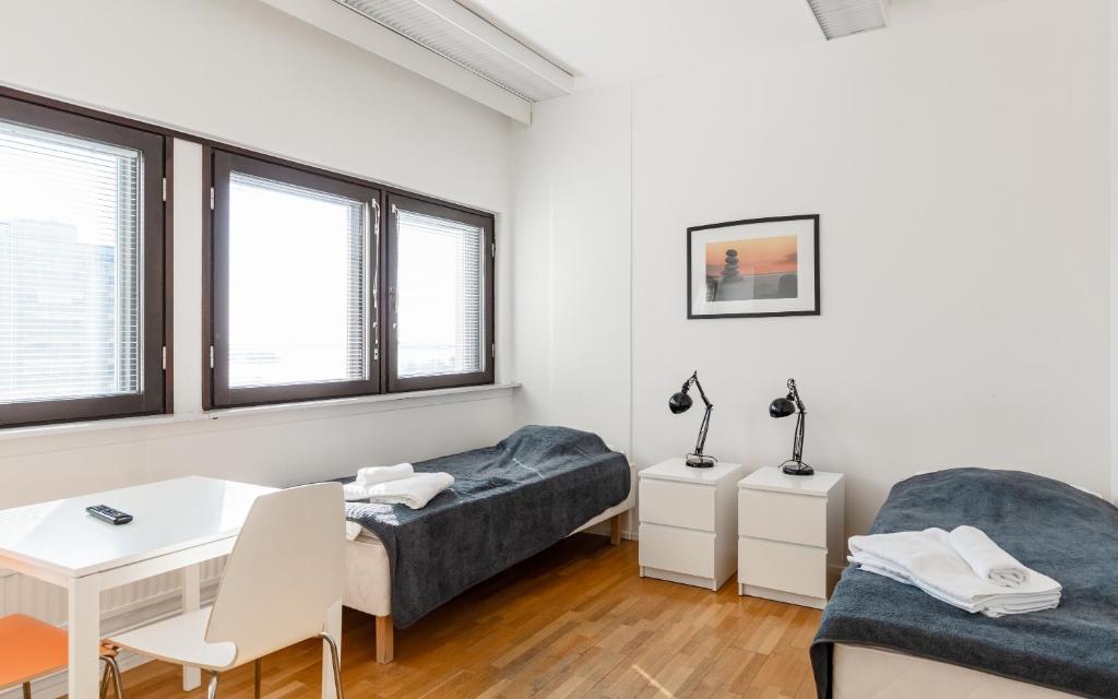 Postel nebo postele na pokoji v ubytování Sky Hostel Helsinki