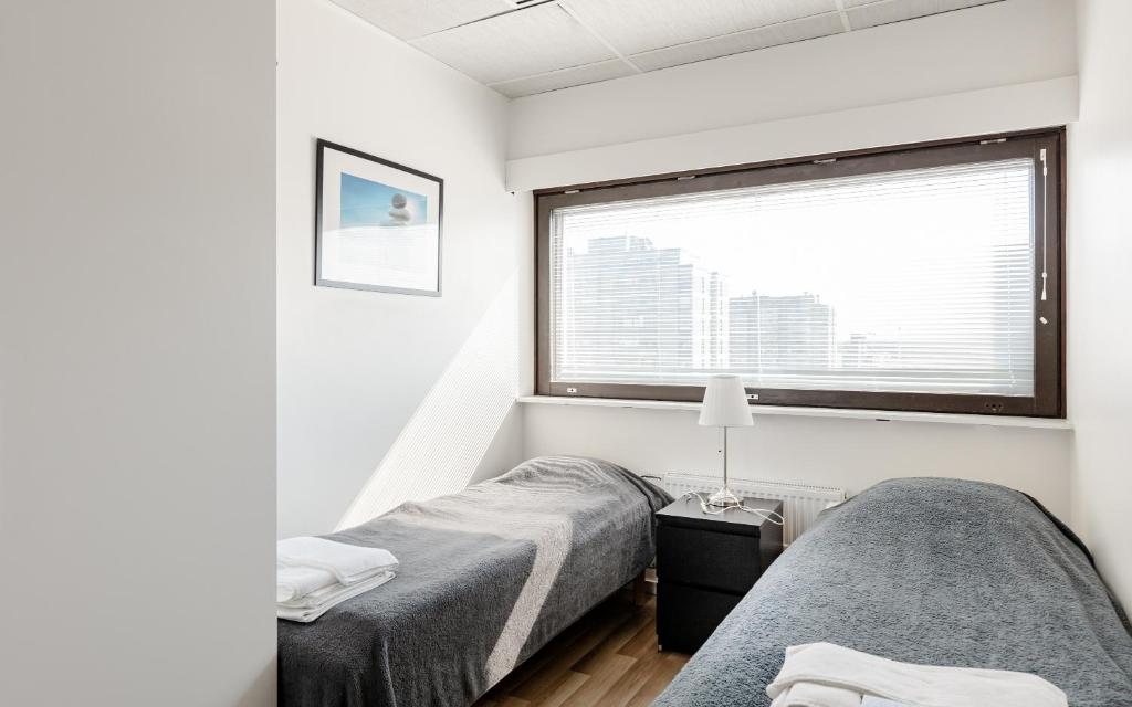 Postel nebo postele na pokoji v ubytování Sky Hostel Helsinki