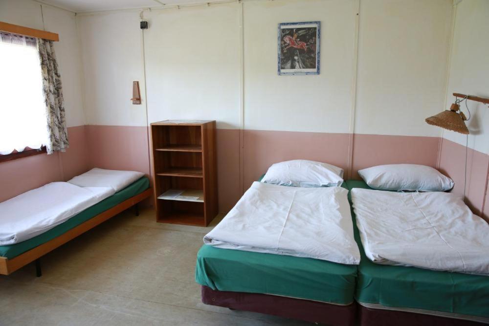 Postel nebo postele na pokoji v ubytování Kemp Rumcajs
