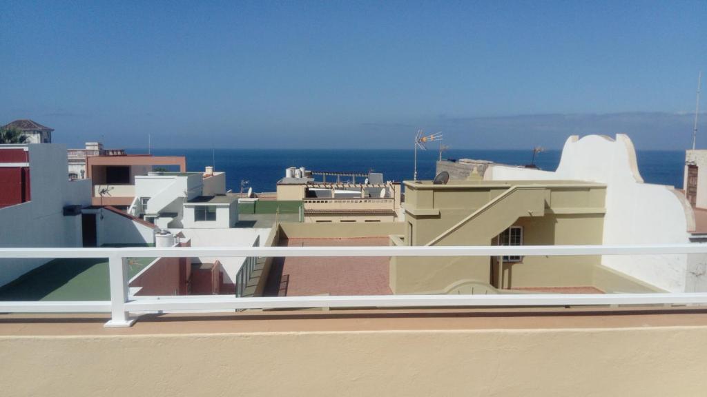 a view of the ocean from the balcony of a building at Apartamento Pequeña Perla in Tazacorte