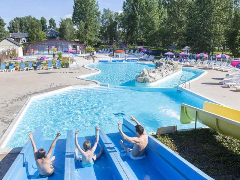 a group of people in a pool at a water park at MOBIL HOME 6/8 places in Onzain