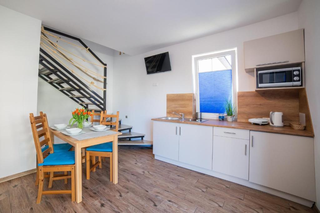 Kuchyňa alebo kuchynka v ubytovaní Rellim Apartamenty