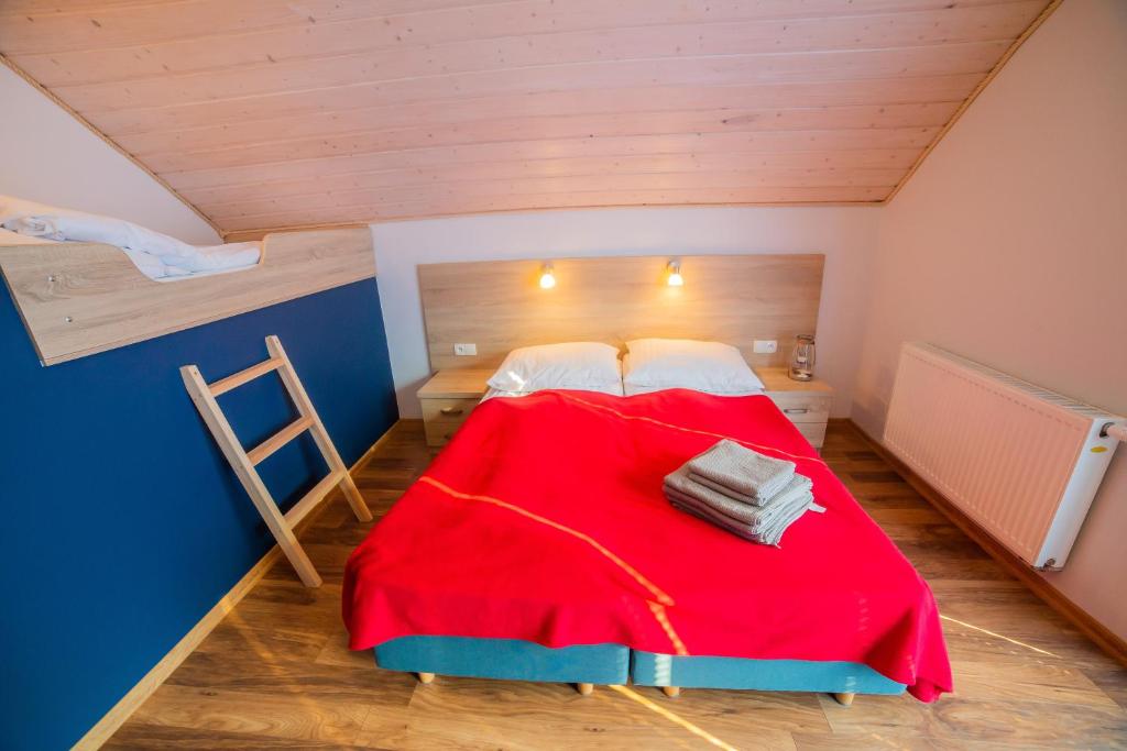 Posteľ alebo postele v izbe v ubytovaní Rellim Apartamenty