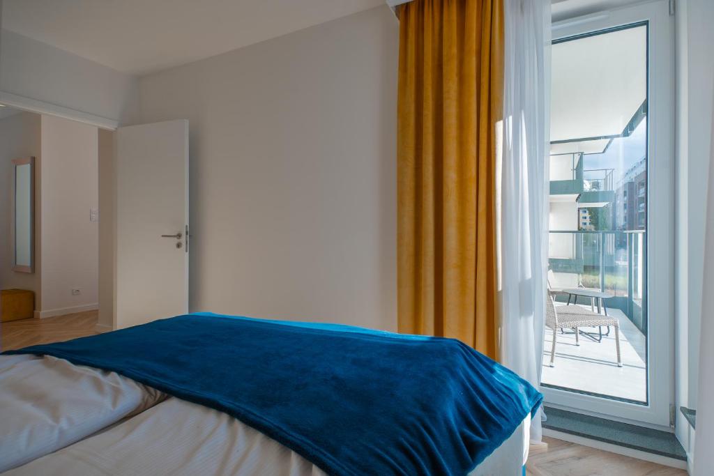Posteľ alebo postele v izbe v ubytovaní CITYSTAY Św.Barbary Apartment