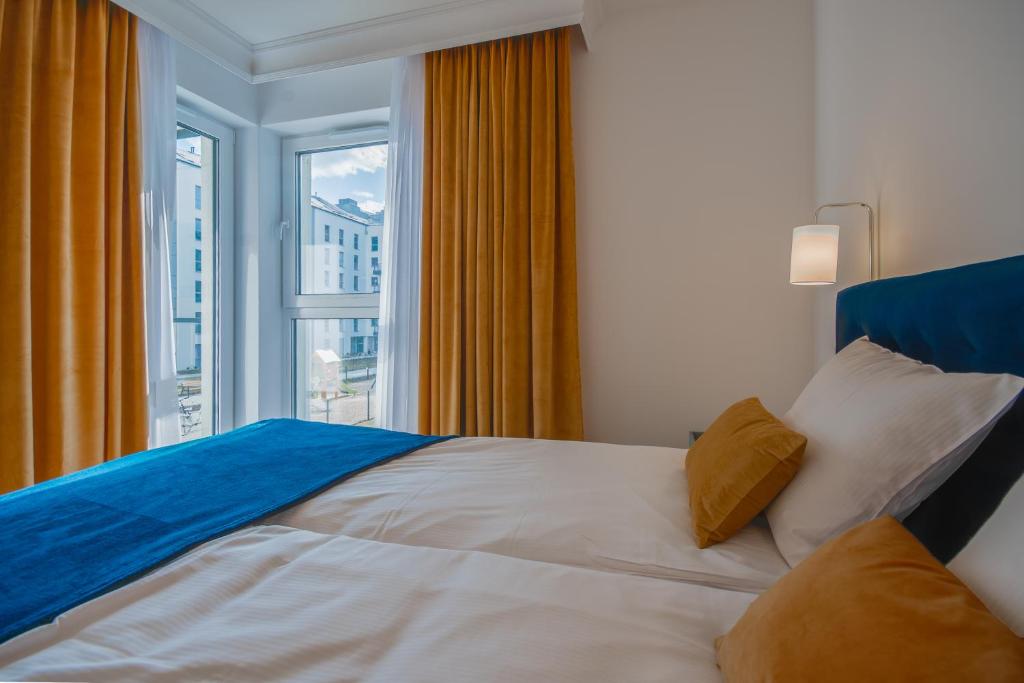 Posteľ alebo postele v izbe v ubytovaní CITYSTAY Św.Barbary Apartment