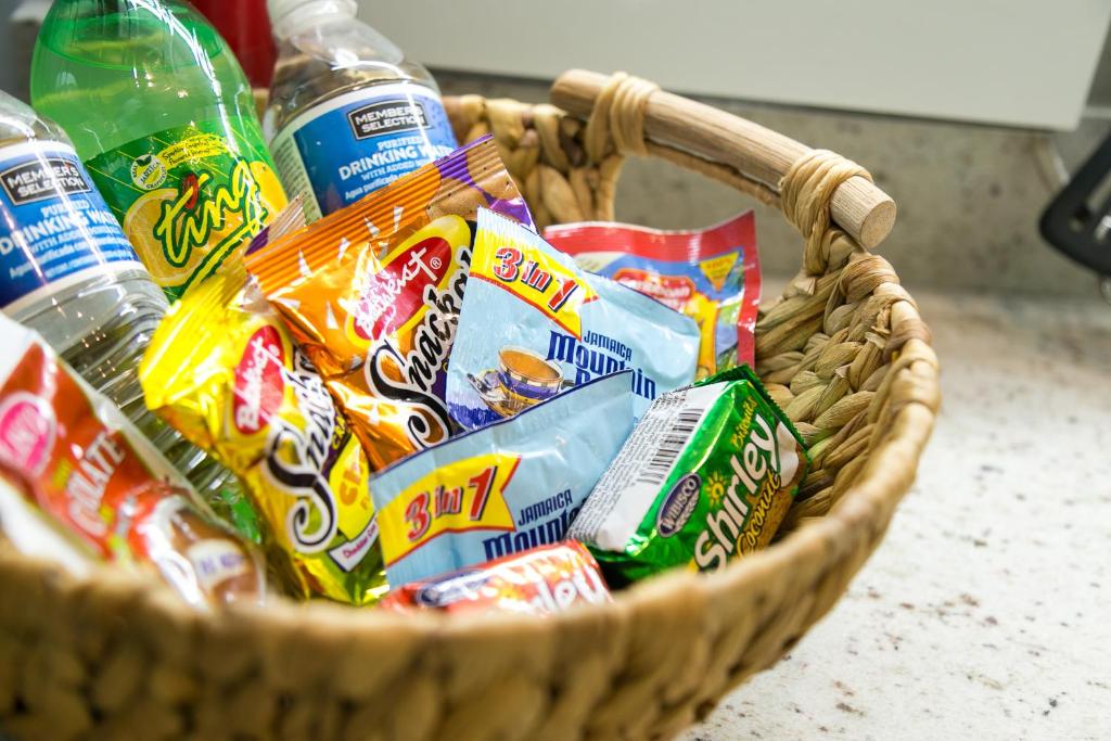 a basket full of chips and drinks on a counter at Choose To Be Happy at Seymour # 9 and #16 - Studio Apartments in Kingston
