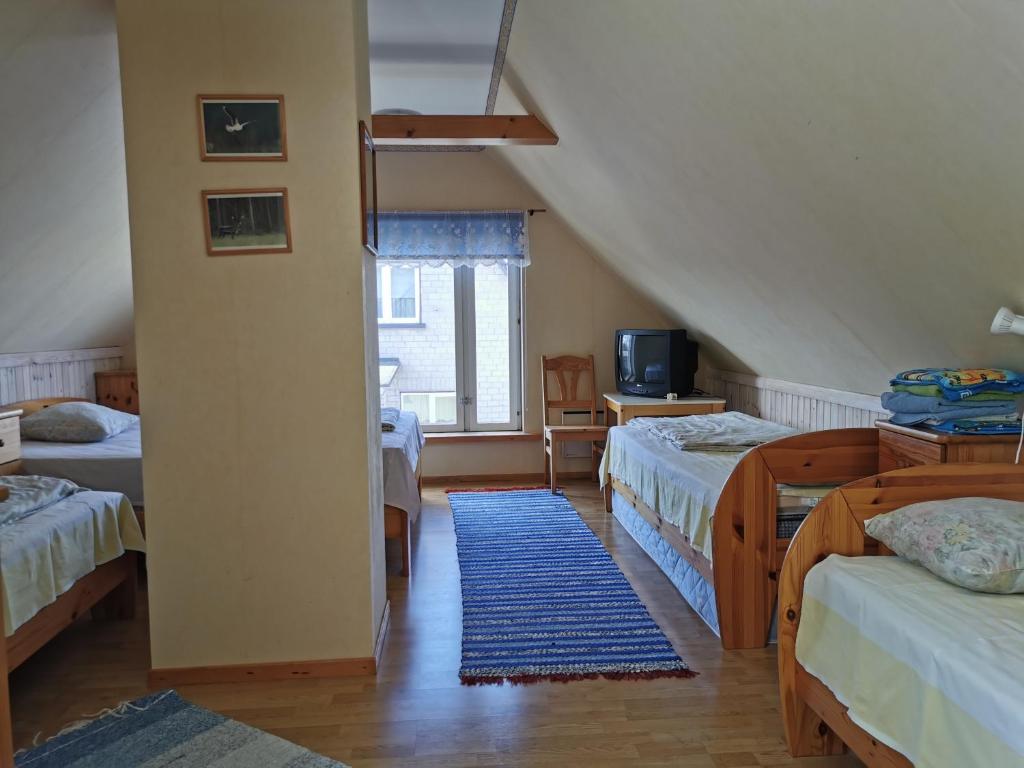 Voodi või voodid majutusasutuse Kaare Guesthouse toas
