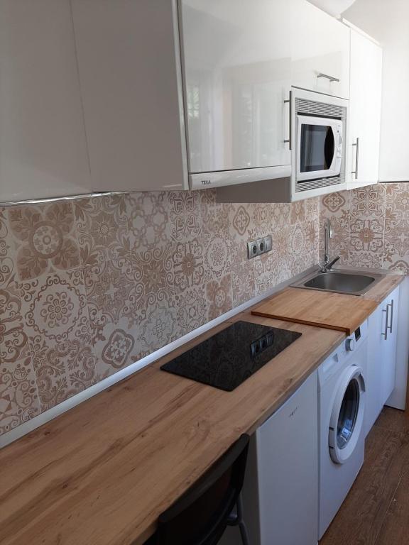 Kuchyň nebo kuchyňský kout v ubytování New Apartment & Parking Alcazaba