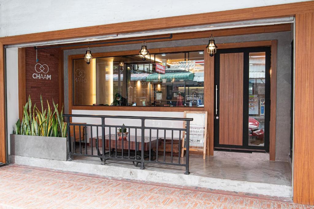 a store front with a bench in front of it at Sureena Hotel in Pattaya