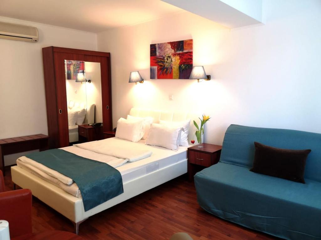 Postel nebo postele na pokoji v ubytování Atrium Hotel Bucharest City Center