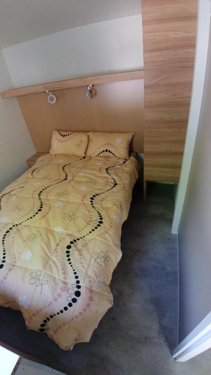 Postel nebo postele na pokoji v ubytování Victoria Mobilehome in Union Camping Cavallino