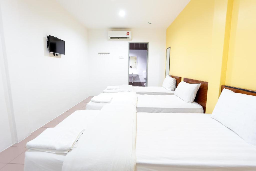 Postel nebo postele na pokoji v ubytování Lux Hotel