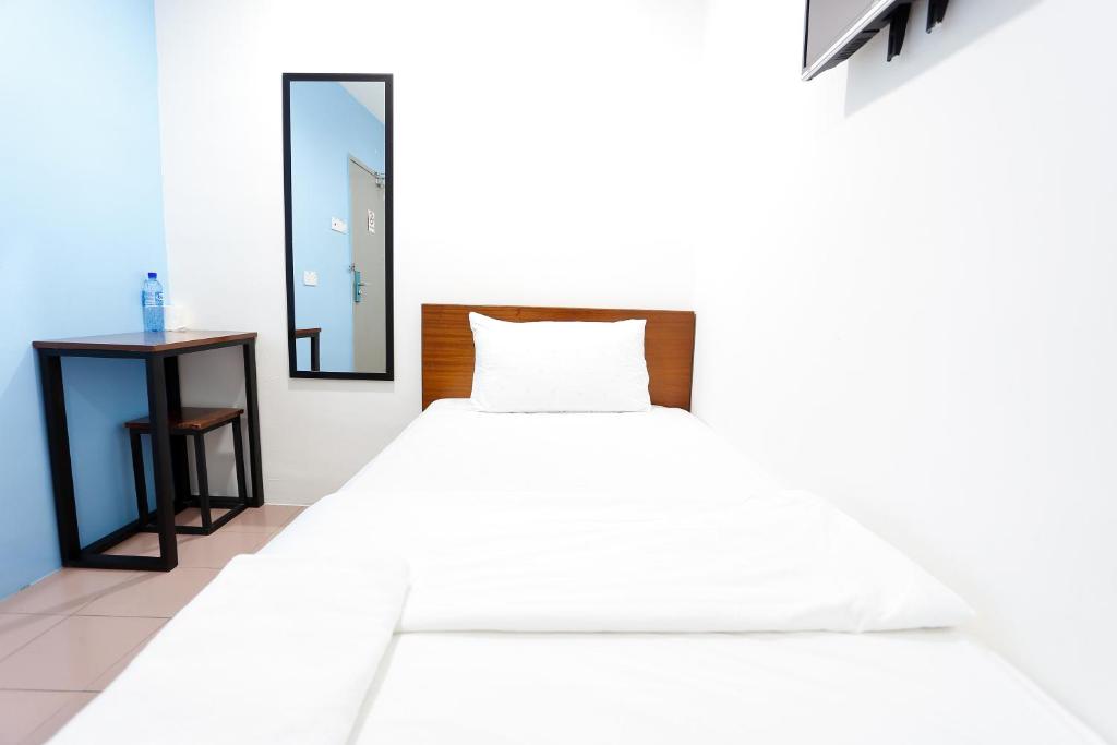 Postel nebo postele na pokoji v ubytování Lux Hotel