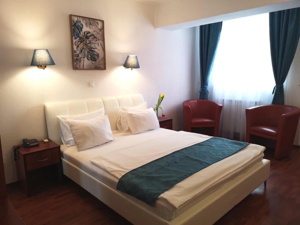 Postel nebo postele na pokoji v ubytování Atrium Hotel Bucharest City Center