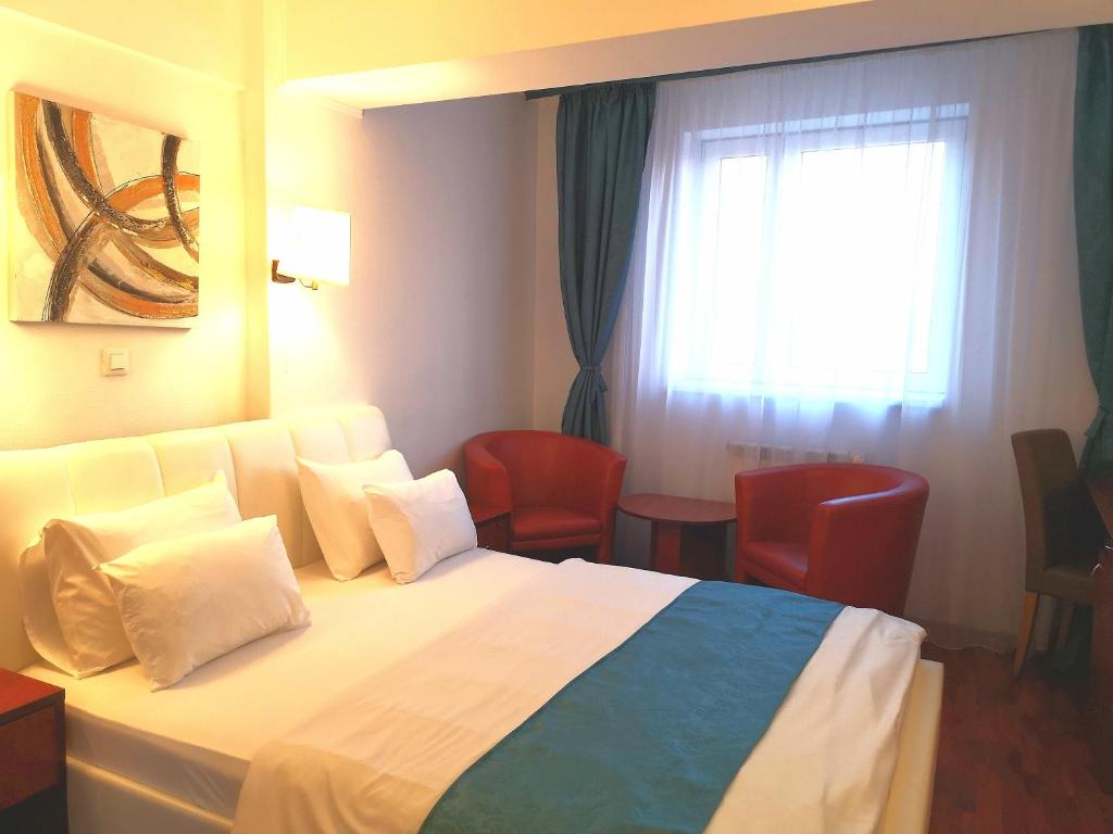 Postel nebo postele na pokoji v ubytování Atrium Hotel Bucharest City Center