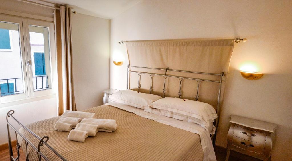 Postel nebo postele na pokoji v ubytování La Corte Dei Sogni B&B