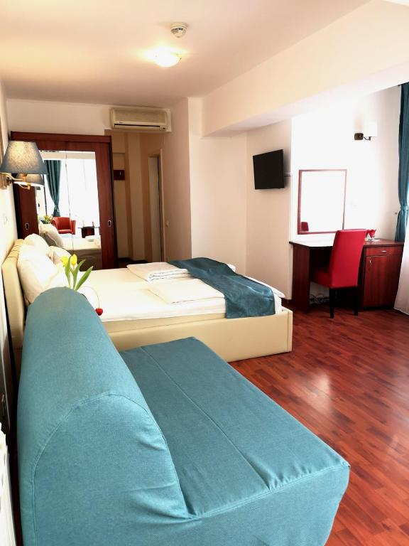 Postel nebo postele na pokoji v ubytování Atrium Hotel Bucharest City Center