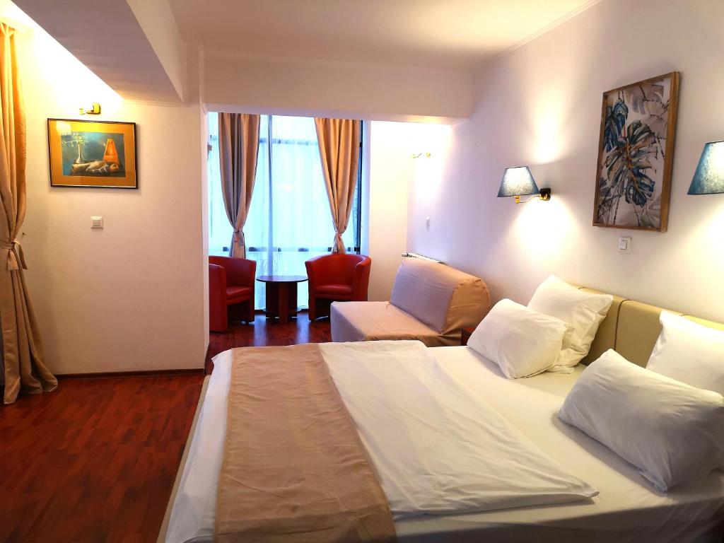Postel nebo postele na pokoji v ubytování Atrium Hotel Bucharest City Center