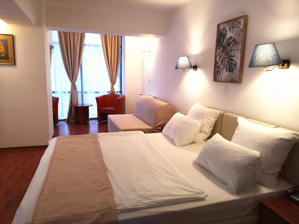 Postel nebo postele na pokoji v ubytování Atrium Hotel Bucharest City Center