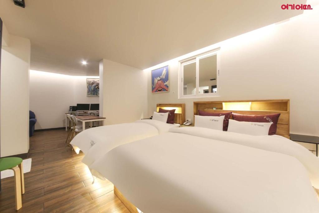 Postel nebo postele na pokoji v ubytování Hotel Yeogijoa