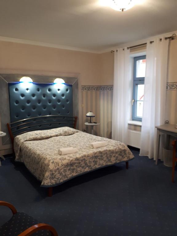 Posteľ alebo postele v izbe v ubytovaní Hotel Marmułowski