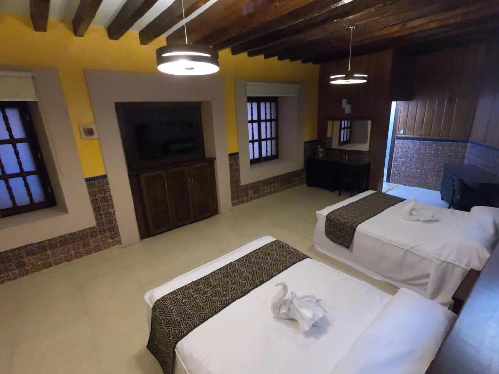Postel nebo postele na pokoji v ubytování Hotel San Diego