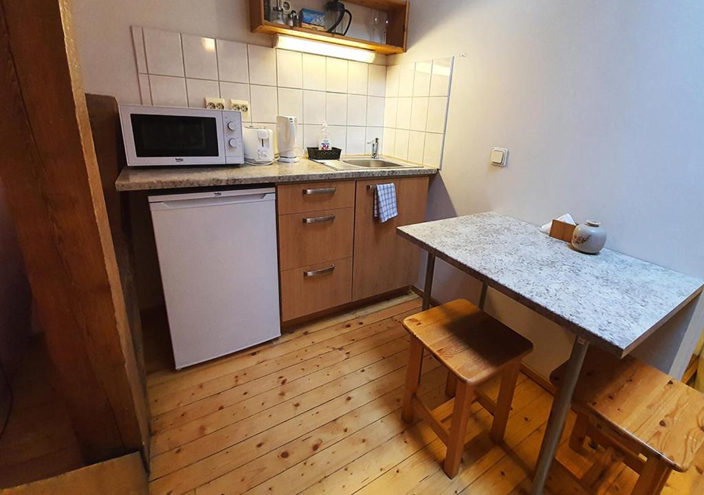 Kuchyň nebo kuchyňský kout v ubytování Villa Hortensia
