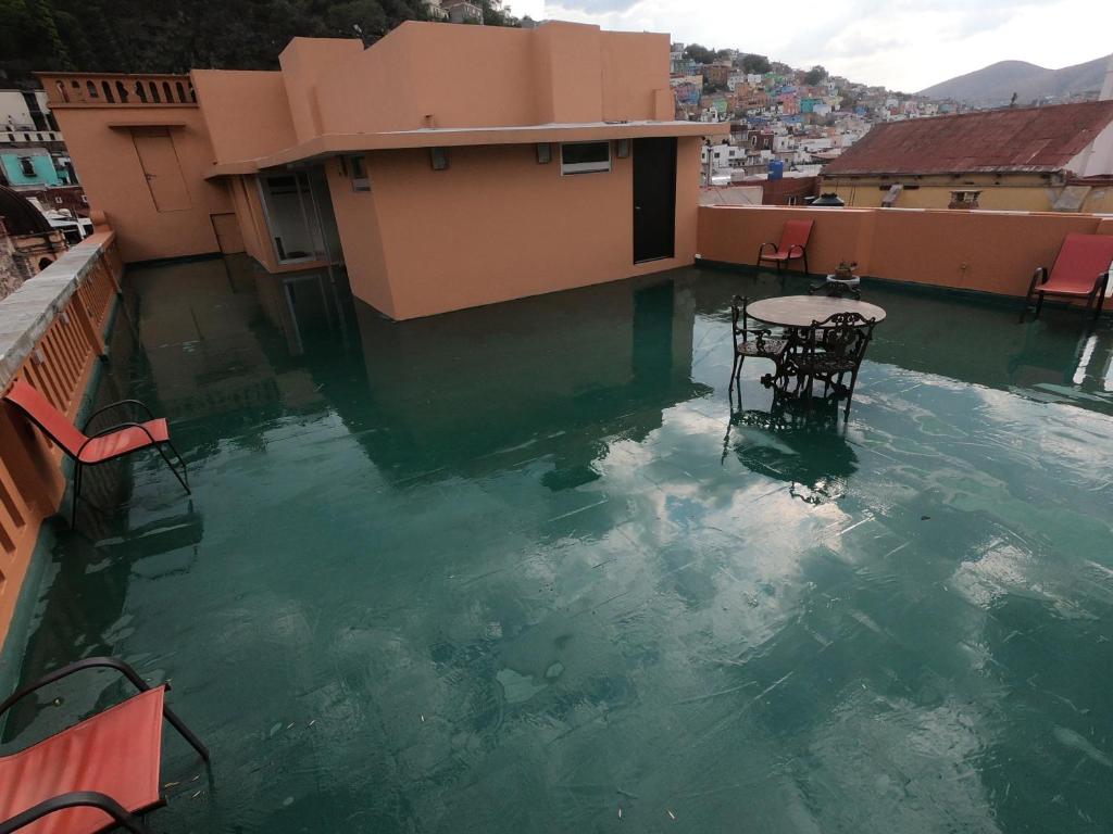 a large body of water with a boat in it at Hotel San Diego in Guanajuato