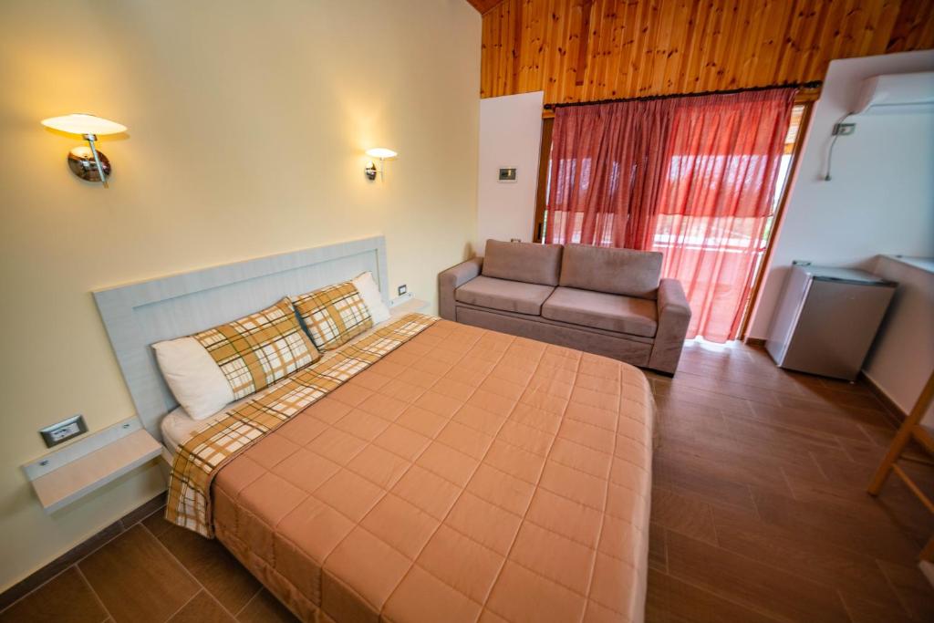 Postel nebo postele na pokoji v ubytování Guest House Luiza