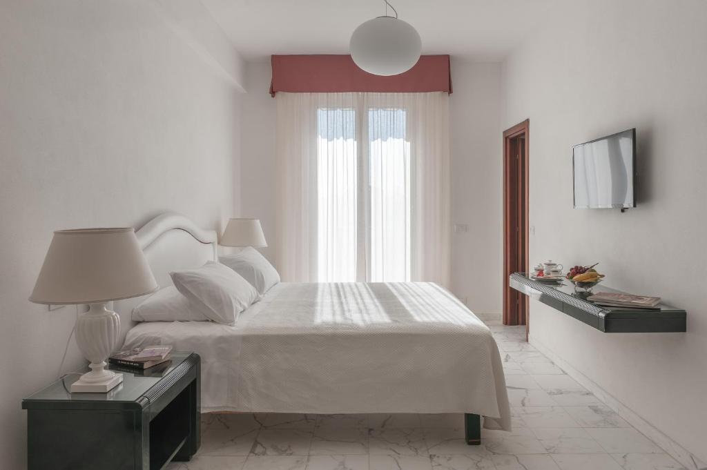 Postel nebo postele na pokoji v ubytování President Hotel