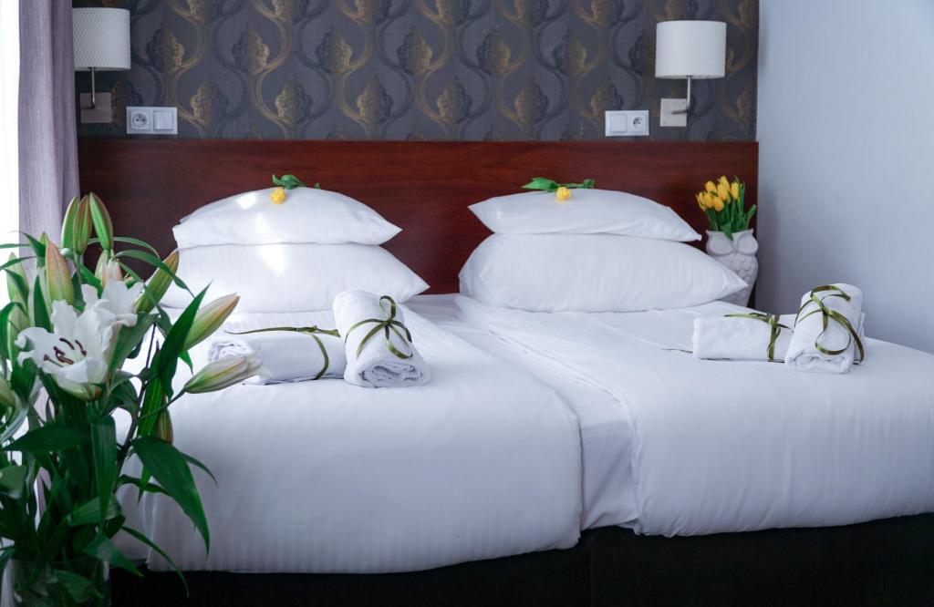 Posteľ alebo postele v izbe v ubytovaní City Center Rooms Piotrkowska 91