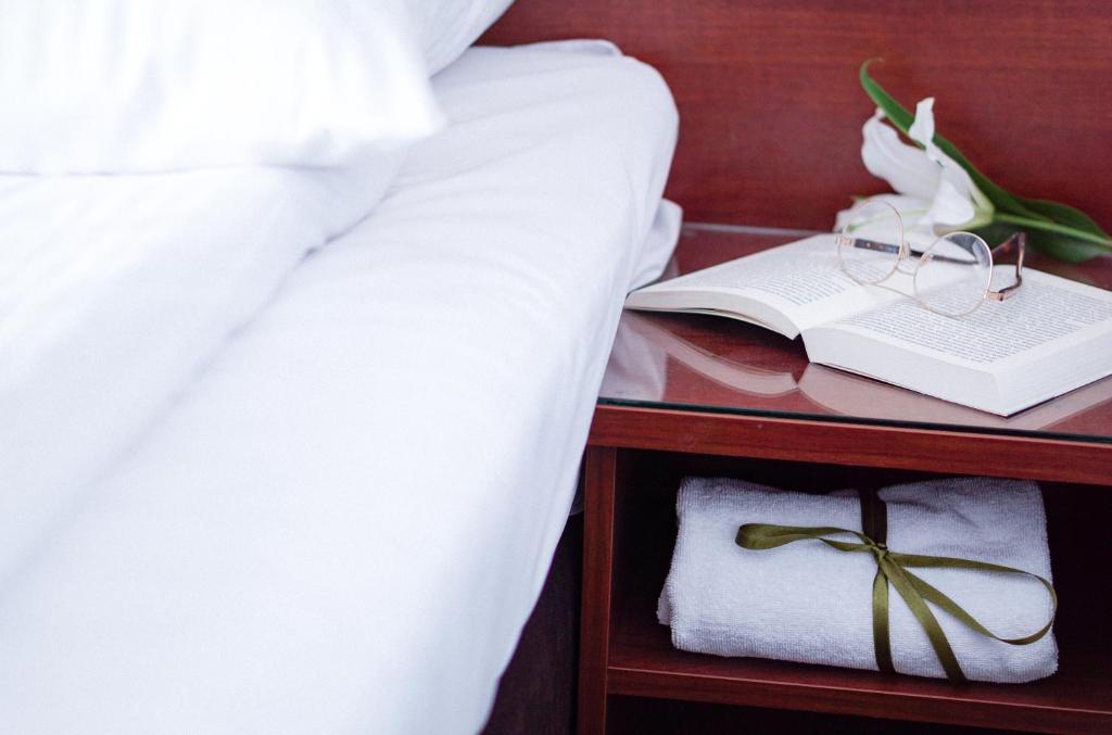 Posteľ alebo postele v izbe v ubytovaní City Center Rooms Piotrkowska 91