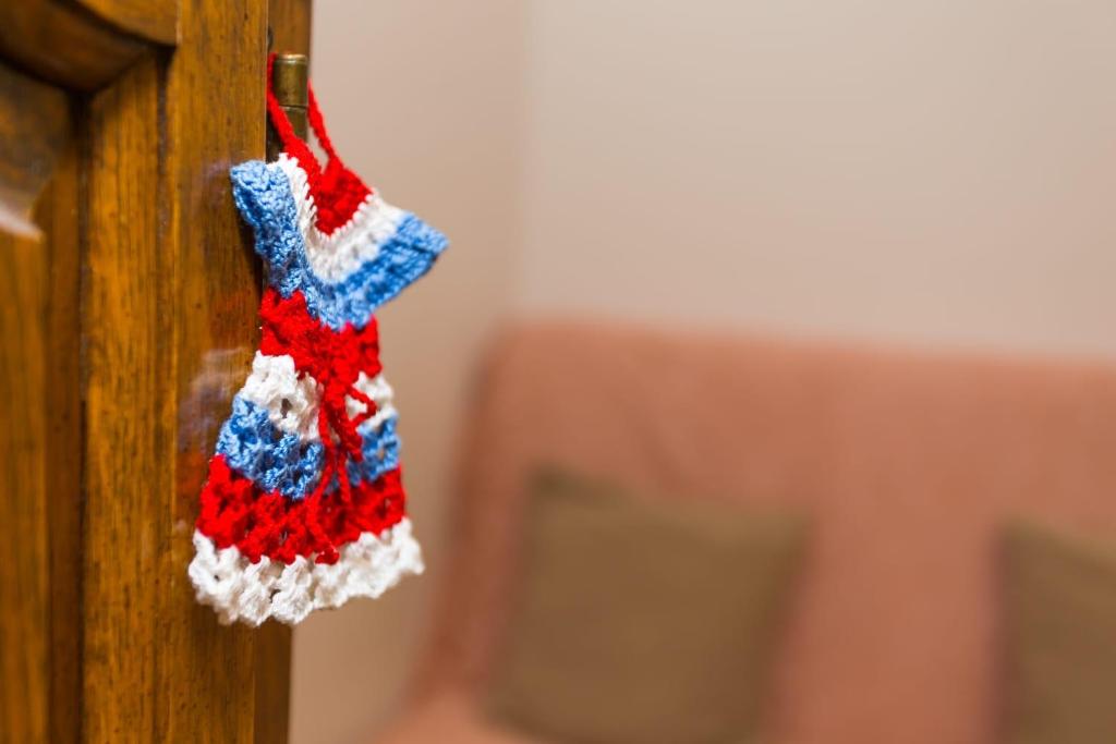 a red white and blue sock hanging on a wall at Hidden Gem in Diocletian Palace Old Town Center Split in Split