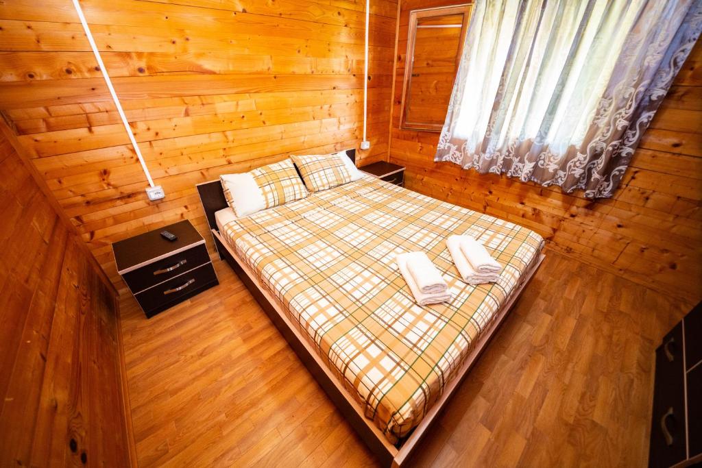 Postel nebo postele na pokoji v ubytování Guest House Luiza