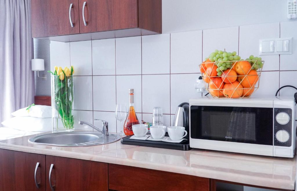 Kuchyňa alebo kuchynka v ubytovaní City Center Rooms Piotrkowska 91