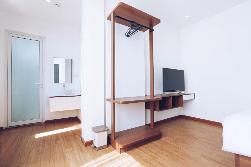 TV a/nebo společenská místnost v ubytování TTR Studio Apart Hotel