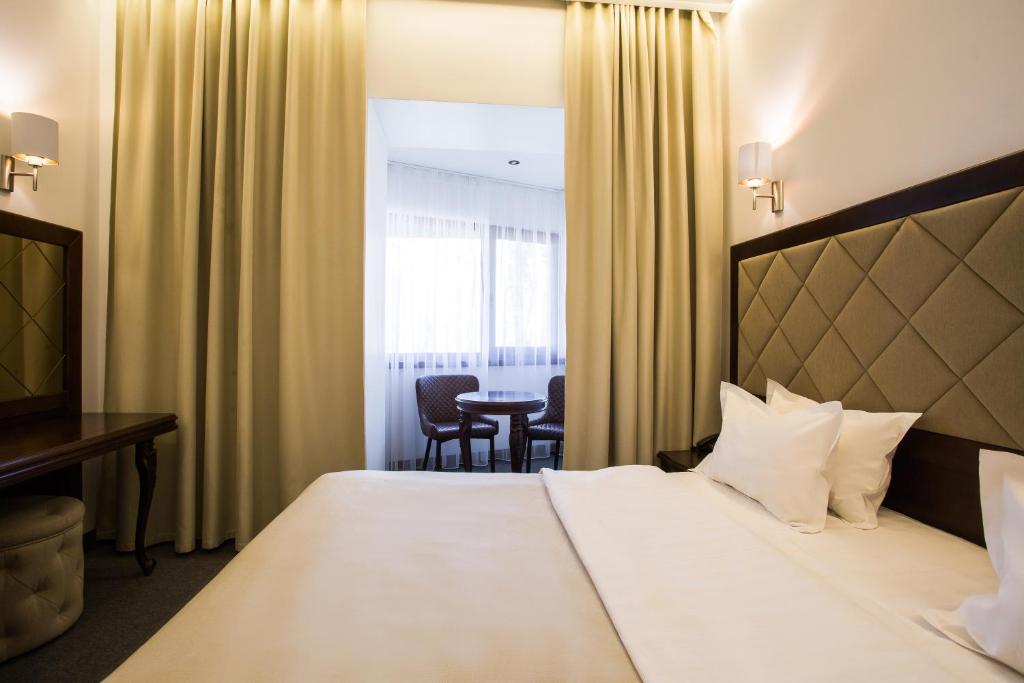 Postel nebo postele na pokoji v ubytování Spa-Hotel Myslyvskiy Dvir