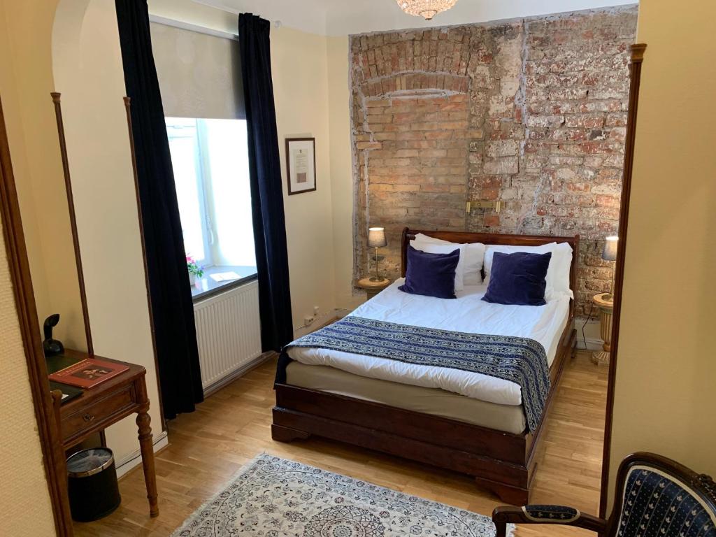 Postel nebo postele na pokoji v ubytování Mayfair Hotel Tunneln