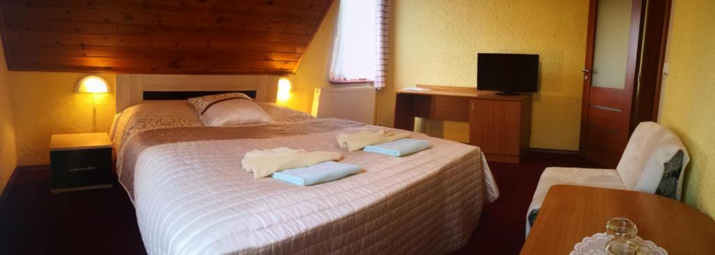 Postel nebo postele na pokoji v ubytování Pension Erika