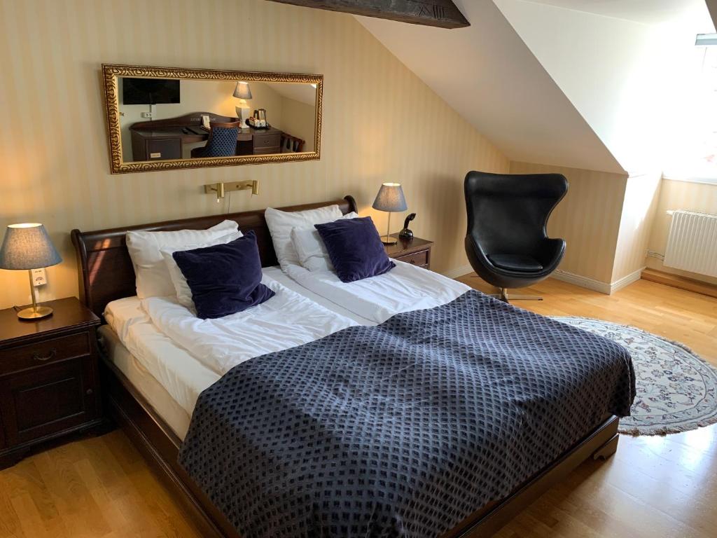 Postel nebo postele na pokoji v ubytování Mayfair Hotel Tunneln