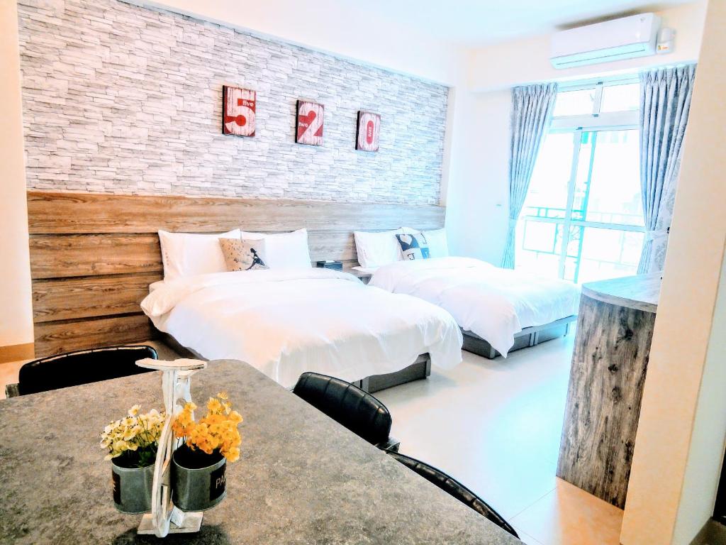 Postel nebo postele na pokoji v ubytování Ruisui Style B&B