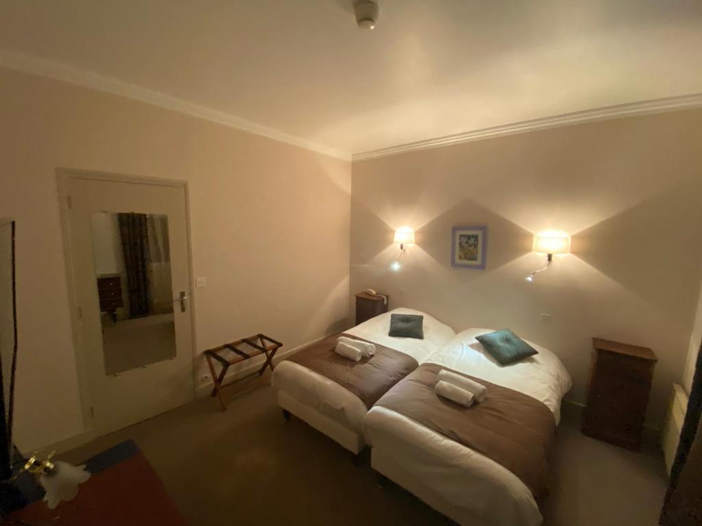 Postel nebo postele na pokoji v ubytování Logis Hôtel restaurant Bel Horizon