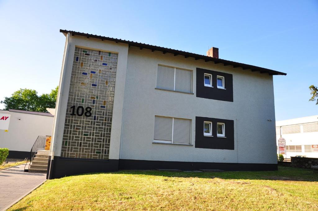 a house with the number on the side of it at Weisenau Plaza in Mainz