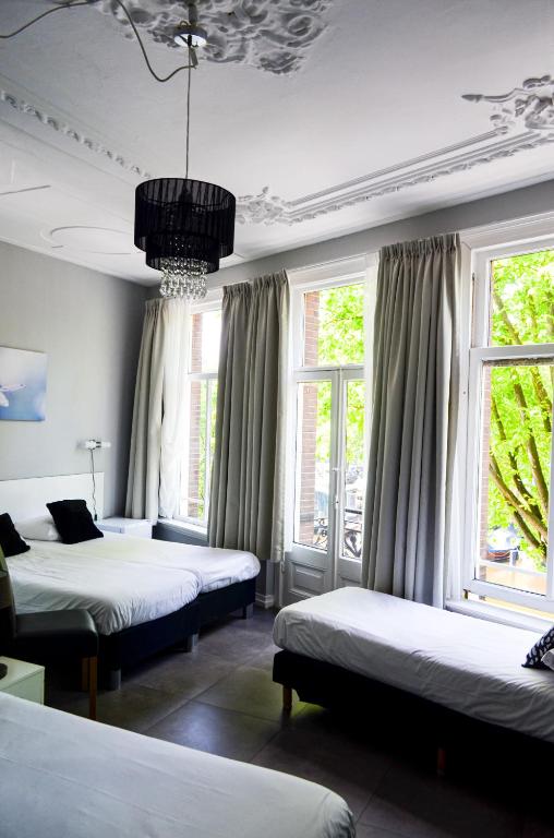 Postel nebo postele na pokoji v ubytování Family Hotel Kooyk
