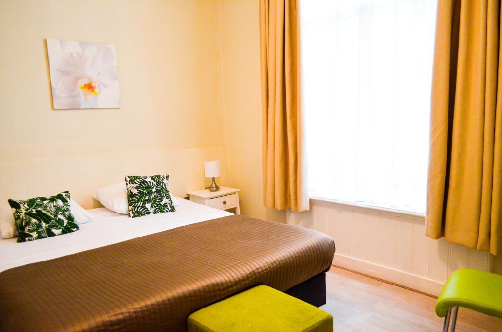 Postel nebo postele na pokoji v ubytování Family Hotel Kooyk