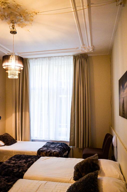 Postel nebo postele na pokoji v ubytování Family Hotel Kooyk