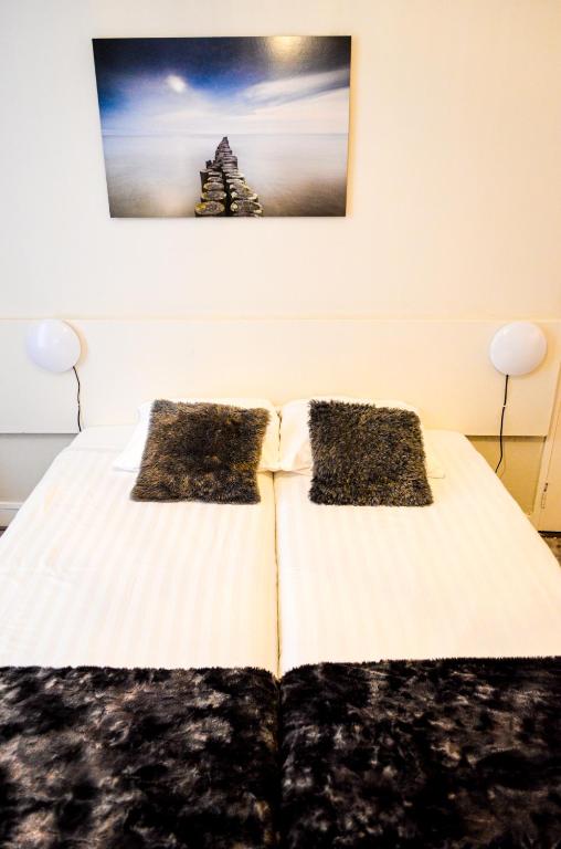 Postel nebo postele na pokoji v ubytování Family Hotel Kooyk