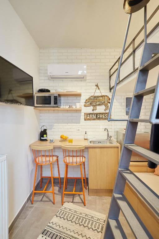 Kuchyňa alebo kuchynka v ubytovaní Mind-blowing petite studio in the heart of Athens!